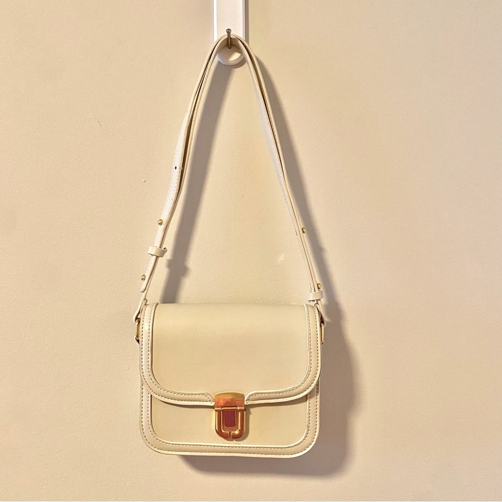Beige bag with gold enclosure